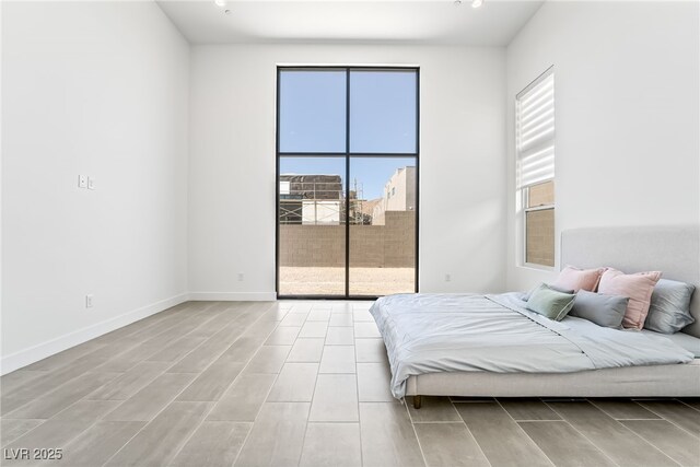 10919 Vista Altura Ave, Las Vegas, NV 89135 - bedroom with access to outside and wood tiled floors