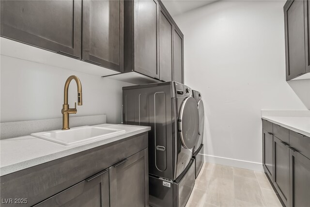 10919 Vista Altura Ave, Las Vegas, NV 89135 - laundry area with washer and dryer and cabinet space