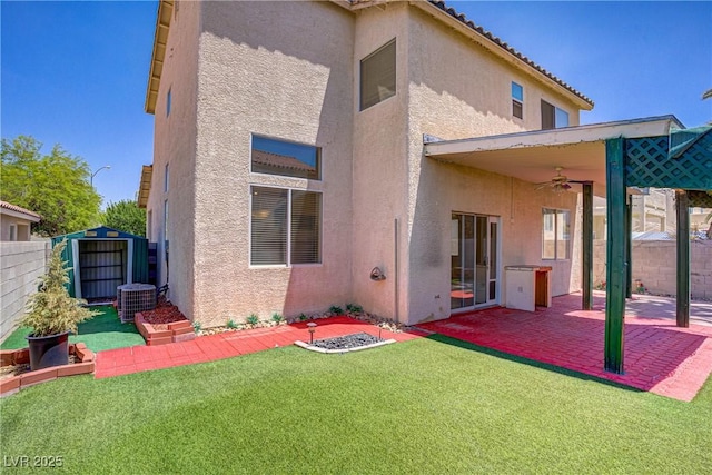 9451 Natoma Station Pl, Las Vegas, NV 89123 - rear view of property with ceiling fan, stucco siding, a patio, and a fenced backyard