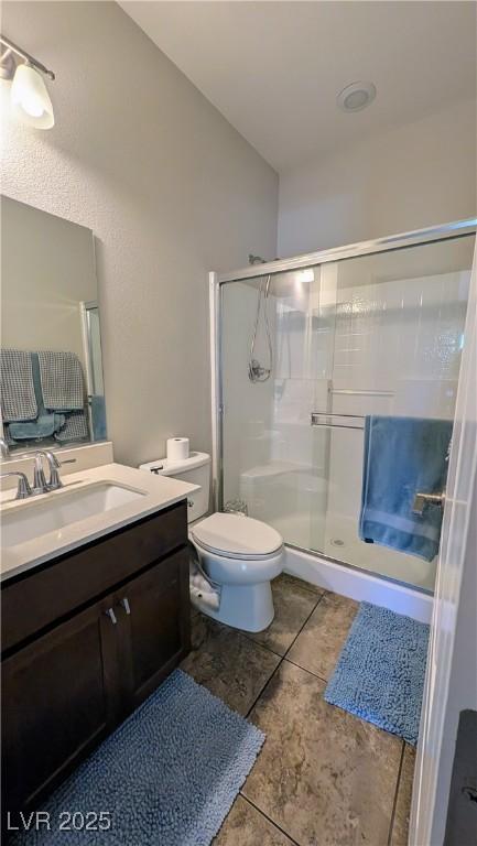 10668 Berkshire Woods Ave, Las Vegas, NV 89166 - full bath featuring a stall shower, vanity, and tile patterned flooring