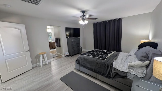 10668 Berkshire Woods Ave, Las Vegas, NV 89166 - bedroom featuring light wood finished floors, a ceiling fan, and connected bathroom