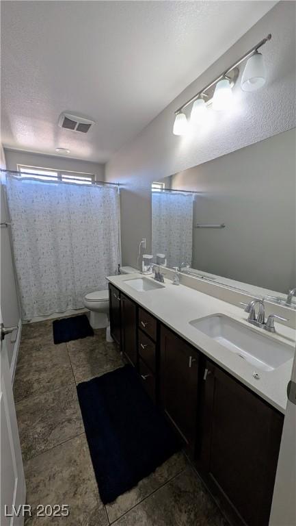 10668 Berkshire Woods Ave, Las Vegas, NV 89166 - bathroom with double vanity, curtained shower, and tile patterned floors