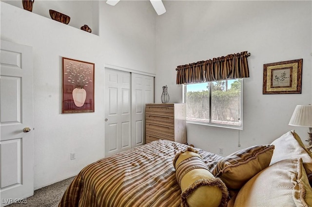 5933 Perfect View St, Las Vegas, NV 89130 - carpeted bedroom with a closet, a towering ceiling, and a ceiling fan