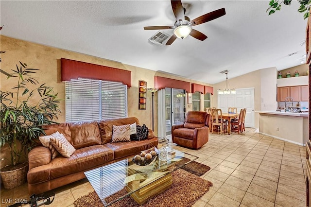 5933 Perfect View St, Las Vegas, NV 89130 - living area featuring vaulted ceiling, ceiling fan, light tile patterned floors, and a chandelier