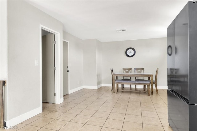 5200 Paradise Skies Ave, Las Vegas, NV 89156 - dining area with light tile patterned flooring and baseboards