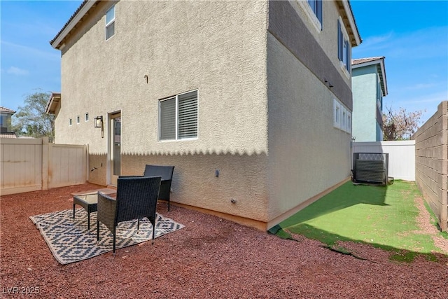 5200 Paradise Skies Ave, Las Vegas, NV 89156 - rear view of house featuring a fenced backyard, stucco siding, and a patio