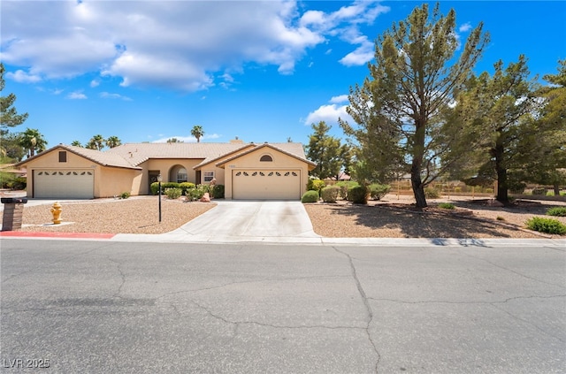 4909 Desert Poppy Dr, Las Vegas, NV 89130 - ranch-style home featuring an attached garage, concrete driveway, and stucco siding