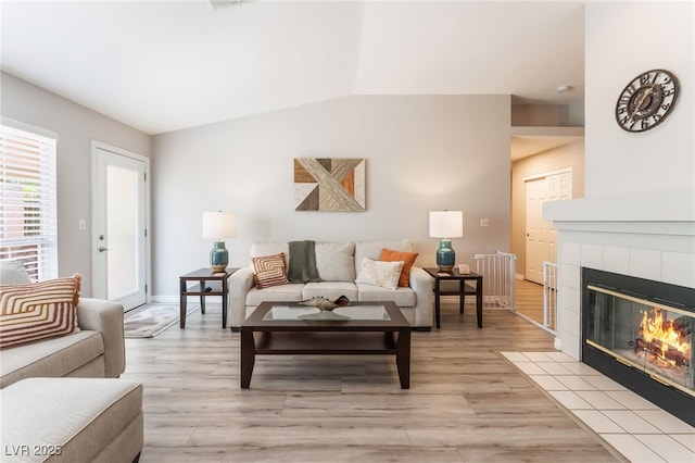 4909 Desert Poppy Dr, Las Vegas, NV 89130 - living area featuring light wood-type flooring and a tile fireplace