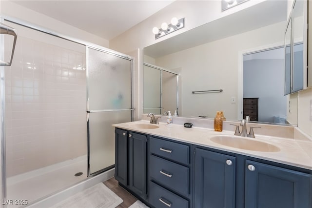 4909 Desert Poppy Dr, Las Vegas, NV 89130 - bathroom featuring double vanity, a stall shower, and connected bathroom