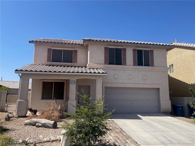 1278 N Sloan Ln, Las Vegas, NV 89110 - view of front of property with an attached garage, stucco siding, concrete driveway, and a tile roof