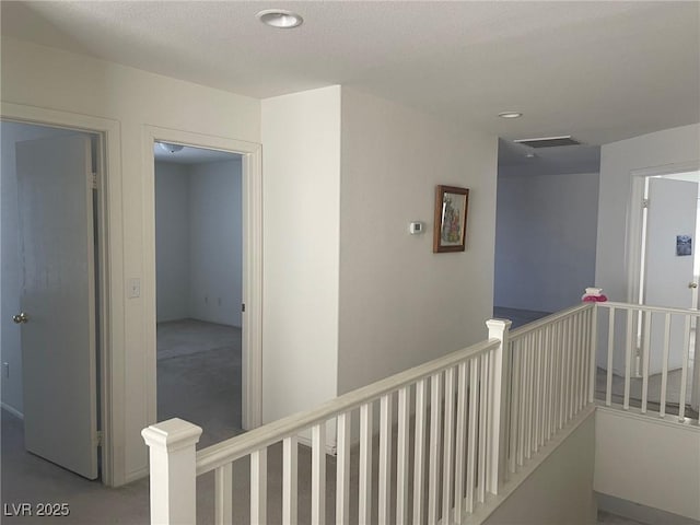 1278 N Sloan Ln, Las Vegas, NV 89110 - hallway with an upstairs landing, carpet floors, and recessed lighting