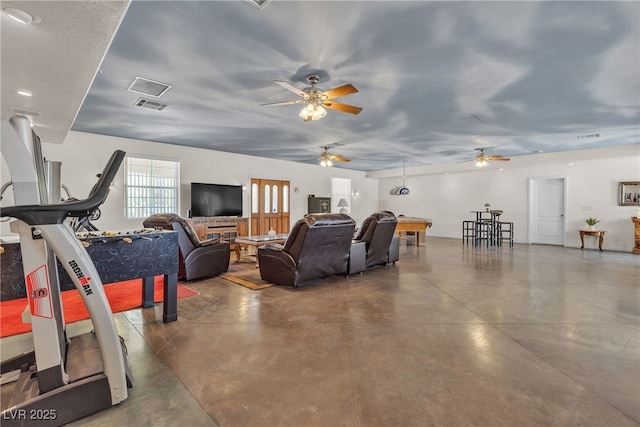 825 W Ryan Ave, Overton, NV 89040 - living room featuring finished concrete floors and a ceiling fan