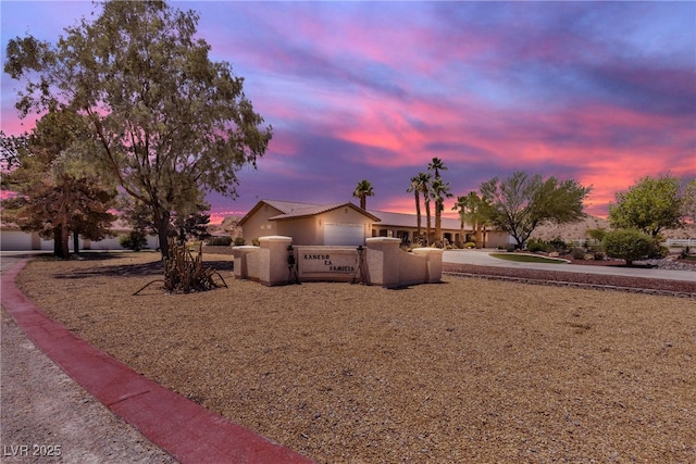 825 W Ryan Ave, Overton, NV 89040 - view of front facade with a fenced front yard and stucco siding