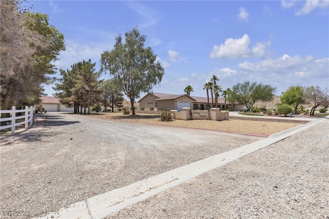 825 W Ryan Ave, Overton, NV 89040 - single story home with a garage and gravel driveway