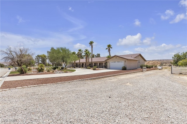 825 W Ryan Ave, Overton, NV 89040 - ranch-style home featuring concrete driveway, a garage, and stucco siding