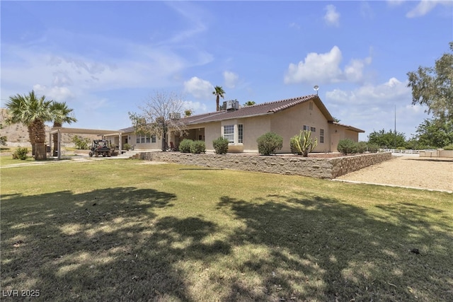 825 W Ryan Ave, Overton, NV 89040 - view of front of property featuring stucco siding and a front yard