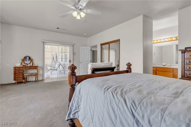 825 W Ryan Ave, Overton, NV 89040 - carpeted bedroom with a ceiling fan and connected bathroom