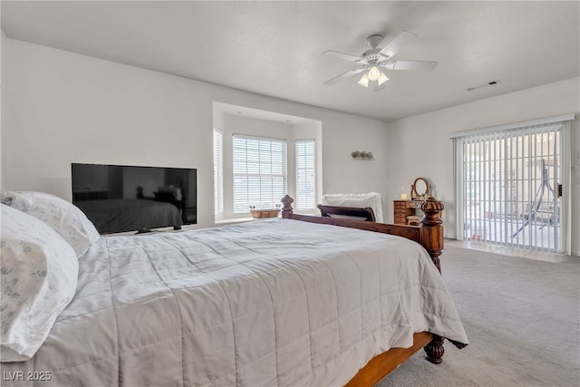 825 W Ryan Ave, Overton, NV 89040 - carpeted bedroom featuring multiple windows and a ceiling fan