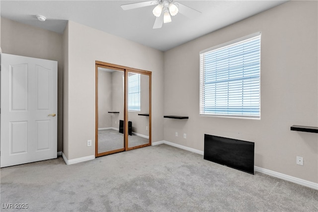 825 W Ryan Ave, Overton, NV 89040 - unfurnished bedroom with carpet flooring, a closet, and a ceiling fan