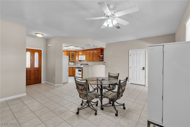 825 W Ryan Ave, Overton, NV 89040 - dining area with light tile patterned flooring and a ceiling fan