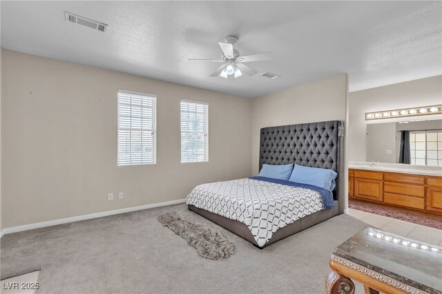 825 W Ryan Ave, Overton, NV 89040 - bedroom featuring light colored carpet, connected bathroom, and a ceiling fan