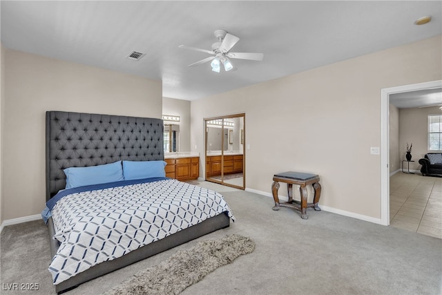 825 W Ryan Ave, Overton, NV 89040 - bedroom with light carpet, a ceiling fan, and ensuite bath