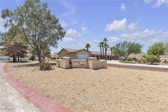 825 W Ryan Ave, Overton, NV 89040 - view of front of property featuring a fenced front yard and stucco siding