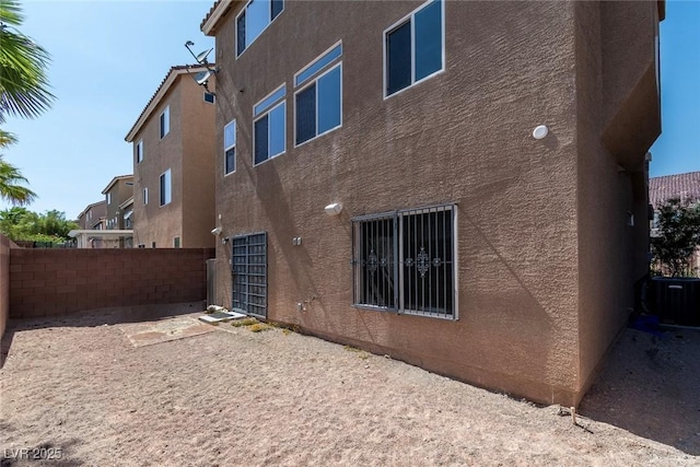 6705 Philharmonic Ave, Las Vegas, NV 89139 - back of house featuring stucco siding