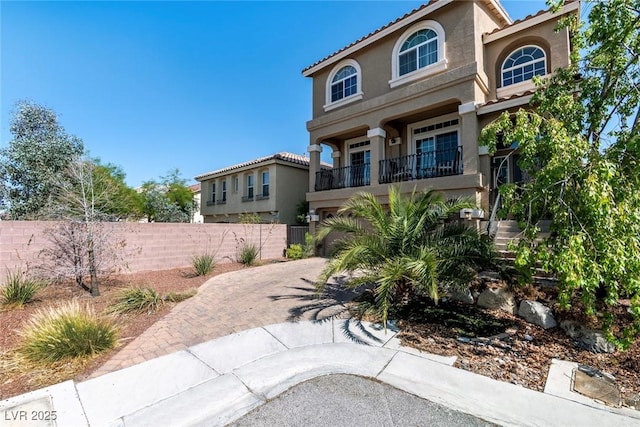 6705 Philharmonic Ave, Las Vegas, NV 89139 - mediterranean / spanish home with stucco siding, decorative driveway, a garage, and a tiled roof