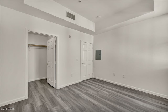 23 E Agate Ave Unit 308, Las Vegas, NV 89123 - unfurnished bedroom with electric panel, wood finished floors, and a closet