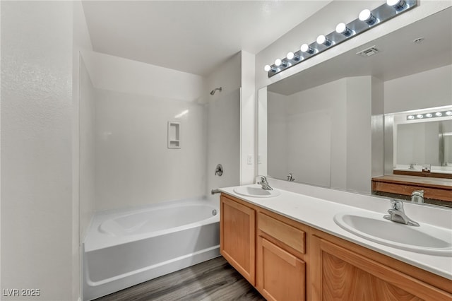 23 E Agate Ave Unit 308, Las Vegas, NV 89123 - bathroom with shower / washtub combination, double vanity, and wood finished floors