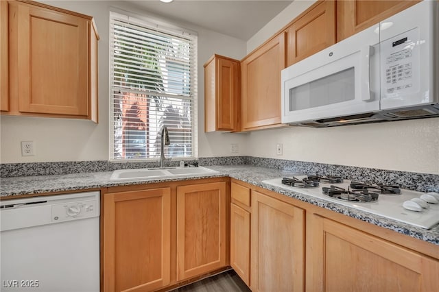 23 E Agate Ave Unit 308, Las Vegas, NV 89123 - kitchen with white appliances and light brown cabinetry