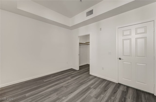 23 E Agate Ave Unit 308, Las Vegas, NV 89123 - unfurnished bedroom featuring dark wood finished floors, a closet, and a spacious closet