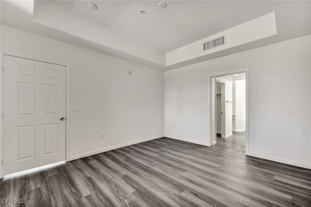 23 E Agate Ave Unit 308, Las Vegas, NV 89123 - spare room with a raised ceiling, wood finished floors, and a smoke detector