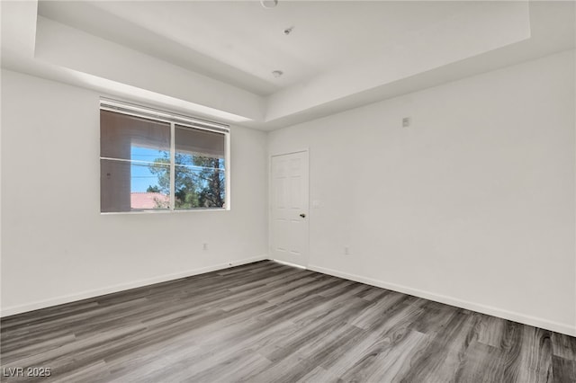 23 E Agate Ave Unit 308, Las Vegas, NV 89123 - unfurnished room featuring a raised ceiling and wood finished floors