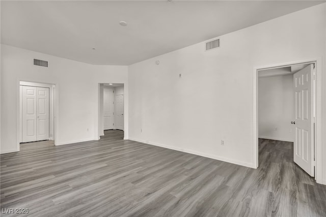 23 E Agate Ave Unit 308, Las Vegas, NV 89123 - unfurnished bedroom with wood finished floors, a closet, and a spacious closet