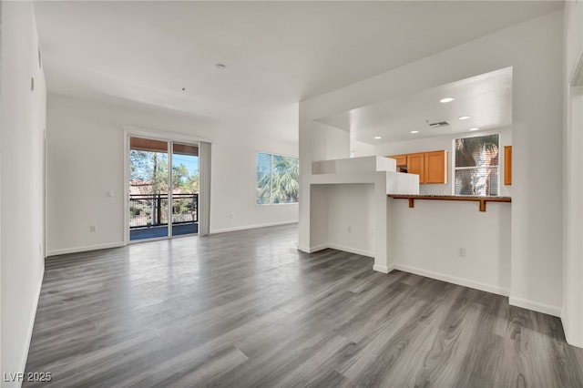 23 E Agate Ave Unit 308, Las Vegas, NV 89123 - unfurnished living room featuring dark wood-type flooring and recessed lighting