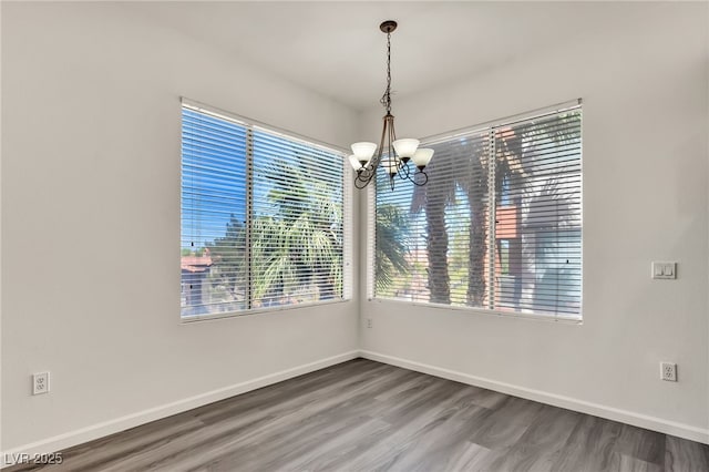 23 E Agate Ave Unit 308, Las Vegas, NV 89123 - spare room featuring a chandelier and wood finished floors