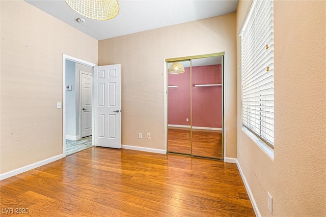 3257 Rushing Waters Pl, Las Vegas, NV 89135 - unfurnished bedroom with wood finished floors and a closet