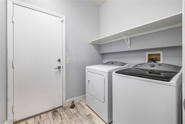3257 Rushing Waters Pl, Las Vegas, NV 89135 - laundry area with separate washer and dryer and light wood-style floors