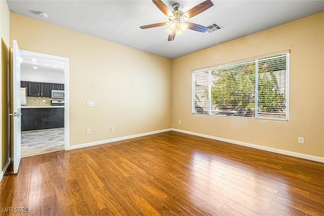 3257 Rushing Waters Pl, Las Vegas, NV 89135 - spare room featuring ceiling fan, wood finished floors, and a smoke detector
