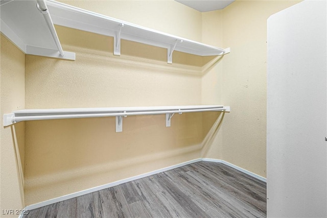3257 Rushing Waters Pl, Las Vegas, NV 89135 - walk in closet featuring wood finished floors