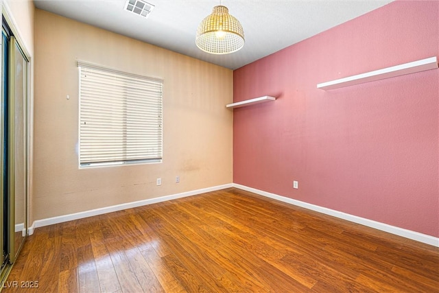 3257 Rushing Waters Pl, Las Vegas, NV 89135 - spare room featuring hardwood / wood-style flooring and baseboards