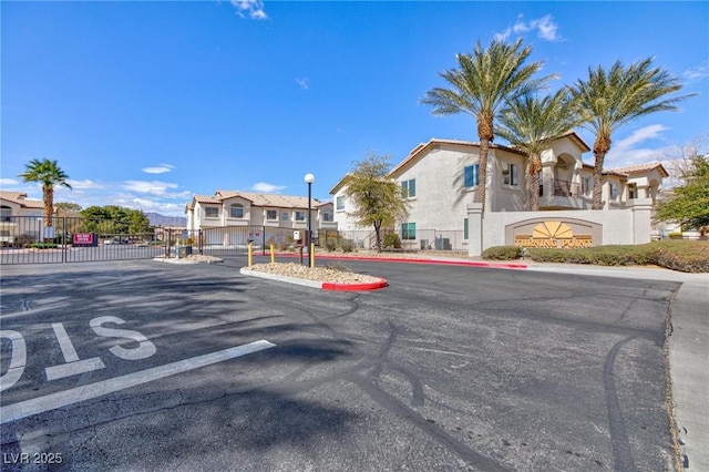 4820 Grey Wolf Ln Unit 101, Las Vegas, NV 89149 - view of asphalt road with a residential view, street lighting, and curbs
