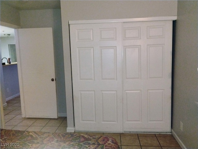 2698 Alicialynn Way, Las Vegas, NV 89121 - unfurnished bedroom featuring tile patterned floors and a closet