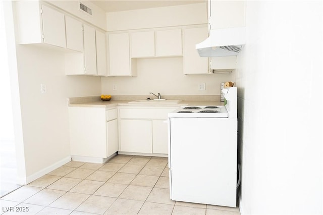 605 S Royal Crest Cir Unit 8, Las Vegas, NV 89169 - kitchen featuring white electric range, custom range hood, light countertops, light tile patterned flooring, and white cabinetry