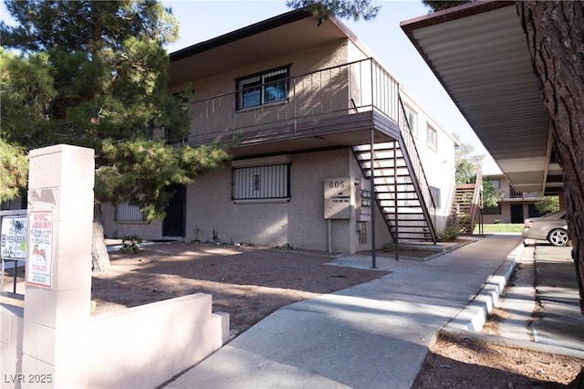 605 S Royal Crest Cir Unit 8, Las Vegas, NV 89169 - view of property exterior featuring stairway and stucco siding