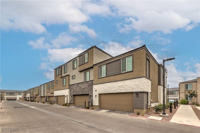 1120 Tektite Ave, Henderson, NV 89011 - view of building exterior featuring a residential view and a garage