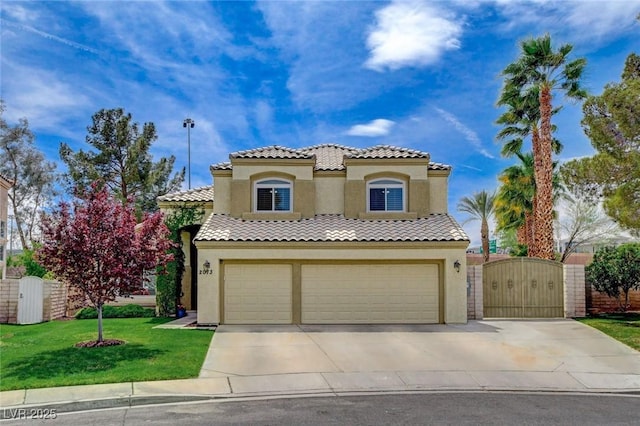 2073 Sapphire Valley Ave, Henderson, NV 89074 - mediterranean / spanish-style home with stucco siding, a gate, and driveway