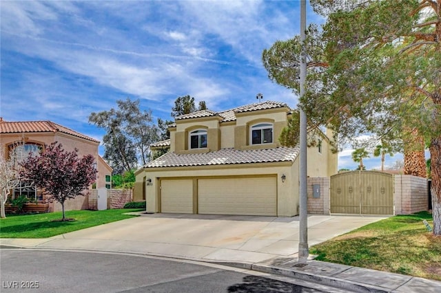 2073 Sapphire Valley Ave, Henderson, NV 89074 - mediterranean / spanish-style home featuring a gate, stucco siding, a garage, driveway, and a tiled roof
